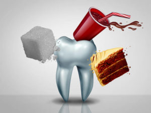 A sugar cube, a red solo cup with soda, and a piece of chocolate cake surround a cartoon drawing of a tooth.