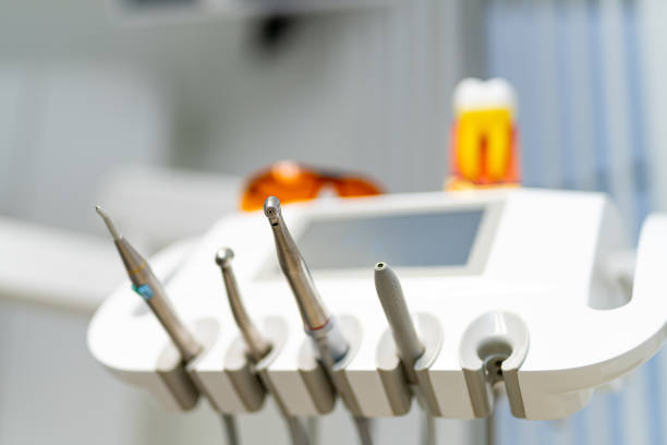 Closeup picture of dental instruments: drill and needle for root canal tooth extraction treatment
